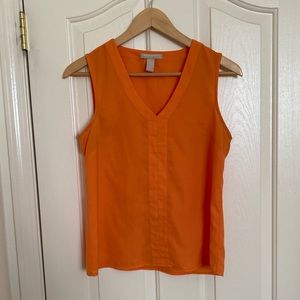 Orange sleeveless blouse